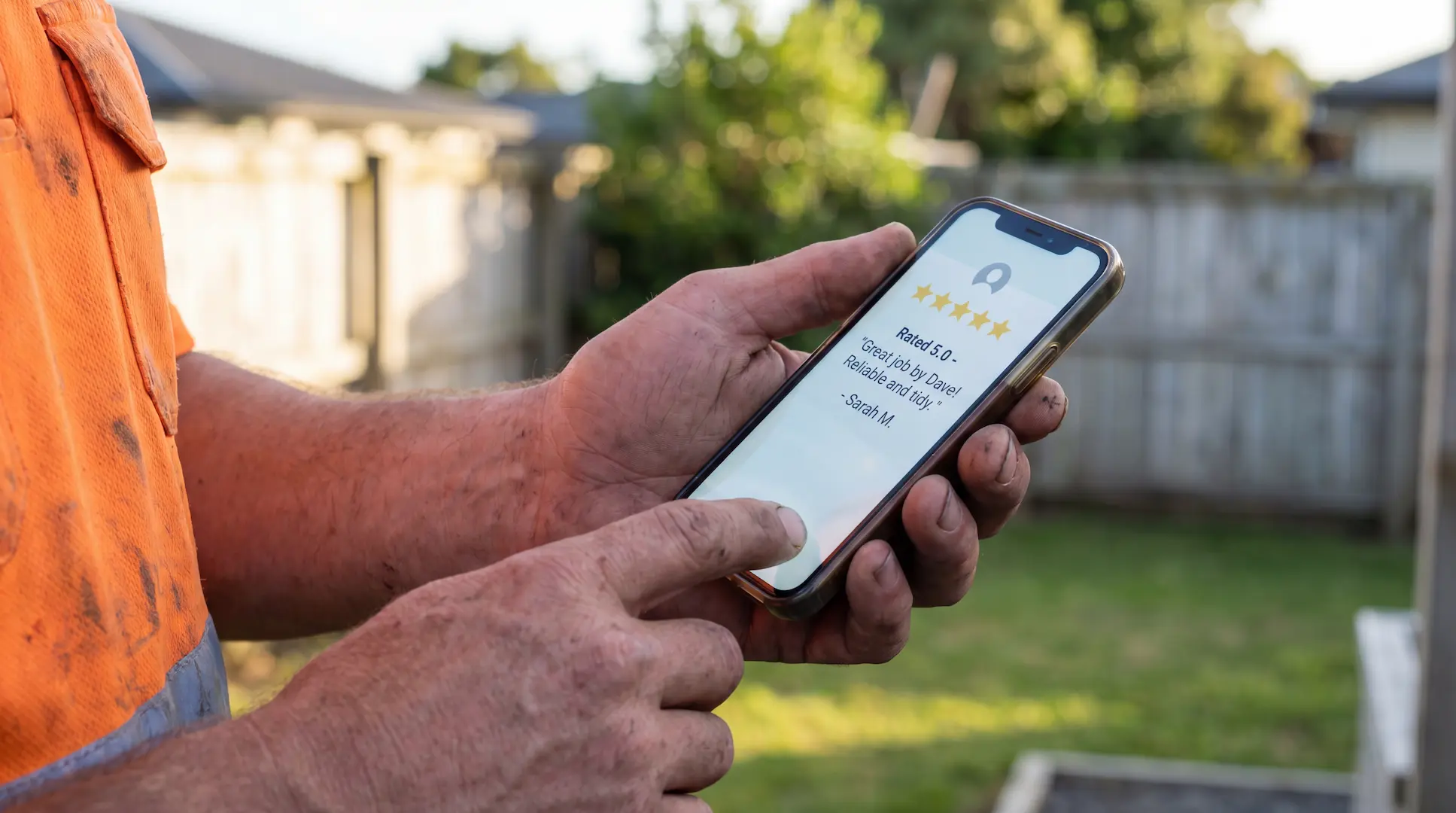Wellington tradie's phone showing a 5-star Google review notification.